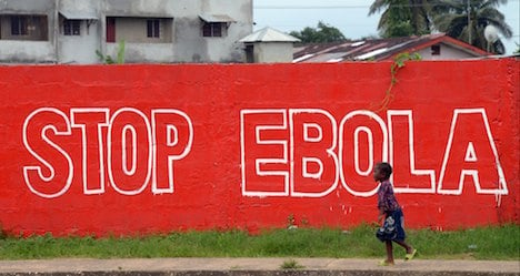 WHO downplays Ebola vaccine trial suspension