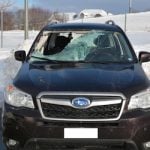 Woman injured as chunk of snow drops on car