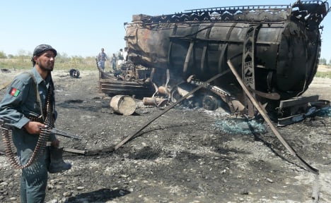 One of the targeted lorries after the air strike in 2009. Photo: DPA