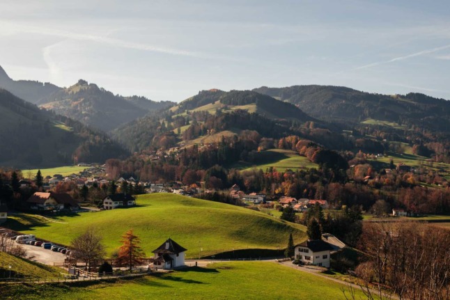 The town of Gruyères, in Switzerland, seen from afar on an autumn day. 