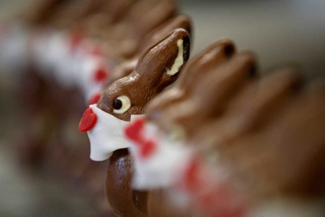 Chocolate bunnies complete with face masks in Easter of 2020. STEFAN WERMUTH / AFP